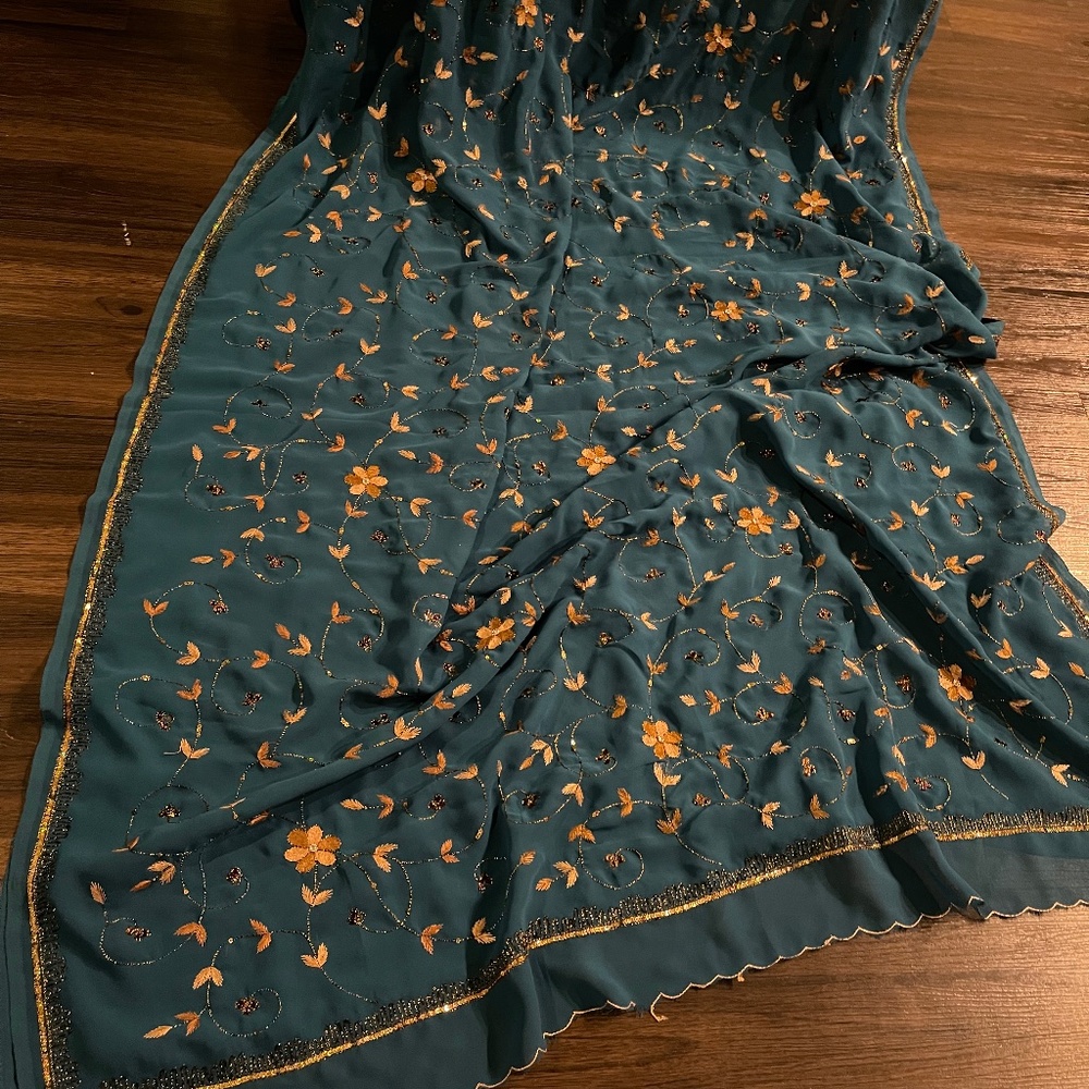 Teal color embroidered georgette saree